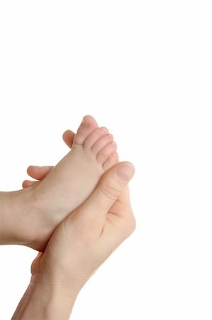 Mother, son, daughter, holding feet with her hand, over white Stock Photo - Budget Royalty-Free & Subscription, Code: 400-04626078