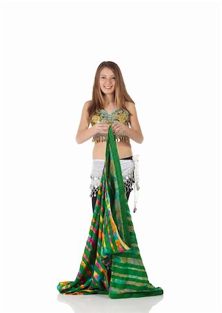 Young Caucasian belly dancing girl in beautiful decorated clothes on white background and reflective floor. Not isolated Foto de stock - Super Valor sin royalties y Suscripción, Código: 400-04627237