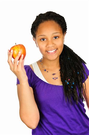 Isolated portrait of black teenage girl holding apple Photographie de stock - Aubaine LD & Abonnement, Code: 400-04628403