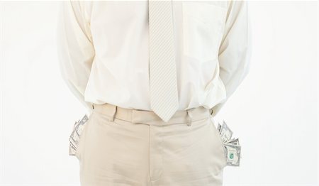 Close-up of successful businessman with pockets full of dollars Stock Photo - Budget Royalty-Free & Subscription, Code: 400-04629317