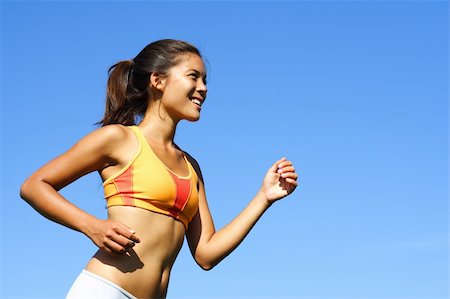 Sporty woman runner in profile on a hot summer day. A lot of copy space. Stock Photo - Budget Royalty-Free & Subscription, Code: 400-04629620