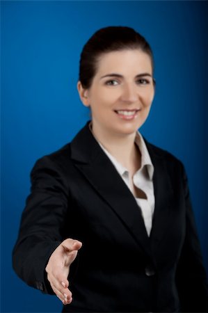 simsearch:400-04351235,k - Beautiful and young businesswoman giving a shake hand Stock Photo - Budget Royalty-Free & Subscription, Code: 400-04629674