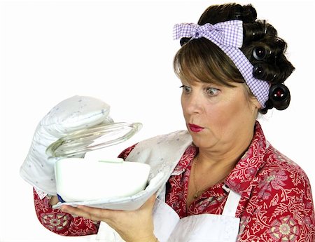 retro wife cooking - Frumpy housewife gets a surprise looking in the baking dish. Stock Photo - Budget Royalty-Free & Subscription, Code: 400-04620358