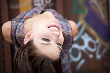 Beautiful Brunette with an edge and darker eye makeupA Sexy Brunette Looking Toward The Camera with an edgy look Stock Photo - Budget Royalty-Free & Subscription, Code: 400-04620674