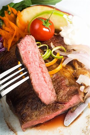 simsearch:400-06079651,k - fresh juicy beef ribeye steak sliced ,with lemon and orange peel on top  and vegetable beside Stock Photo - Budget Royalty-Free & Subscription, Code: 400-04621156