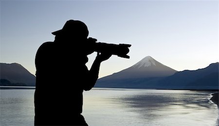 simsearch:400-04590657,k - Man silhouette photographing a volcano Stock Photo - Budget Royalty-Free & Subscription, Code: 400-04621792