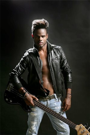 simsearch:400-04131198,k - Afro american rock star musician with leather jacket and bass guitar Stock Photo - Budget Royalty-Free & Subscription, Code: 400-04622217