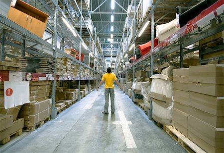 man  in big storehouse photo Stock Photo - Budget Royalty-Free & Subscription, Code: 400-04622787