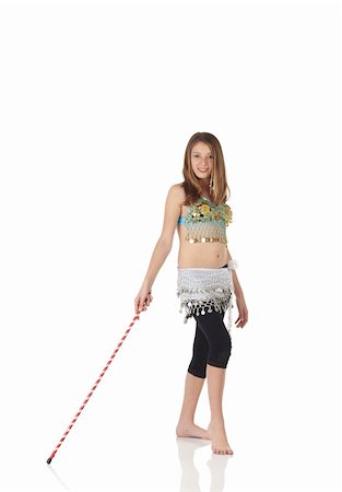 Young Caucasian belly dancing girl in beautiful decorated clothes on white background and reflective floor. Not isolated Foto de stock - Super Valor sin royalties y Suscripción, Código: 400-04623152