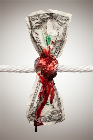 Wrinkled American Dollar Tied Up and Bleeding in Rope. Stock Photo - Budget Royalty-Free & Subscription, Code: 400-04623258