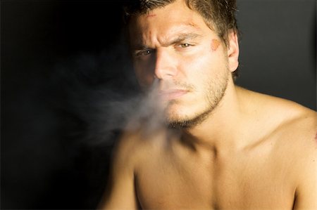 edgy - A portrait of a young sexy man smoking a cigarette Stock Photo - Budget Royalty-Free & Subscription, Code: 400-04635633