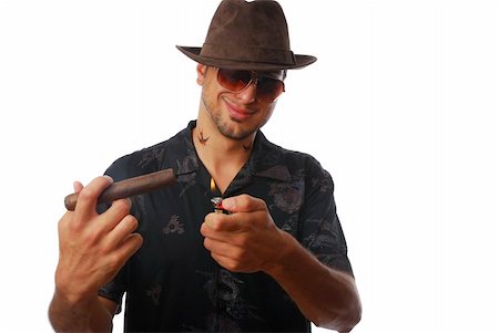 simsearch:400-05207678,k - A pretty cool guy in a hat lighting a cigar Stock Photo - Budget Royalty-Free & Subscription, Code: 400-04636100
