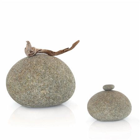 simsearch:400-04016023,k - Zen abstract of two grey stones one with a piece of driftwood the other with a small stone balanced on the top, over white background. Stock Photo - Budget Royalty-Free & Subscription, Code: 400-04636372
