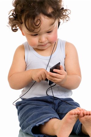 simsearch:400-04638236,k - Child with mp 3 player,isolated on a white background. Photographie de stock - Aubaine LD & Abonnement, Code: 400-04637186