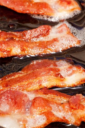 simsearch:400-04885499,k - Bacon detail frying in a frying pan with grease Stock Photo - Budget Royalty-Free & Subscription, Code: 400-04638280