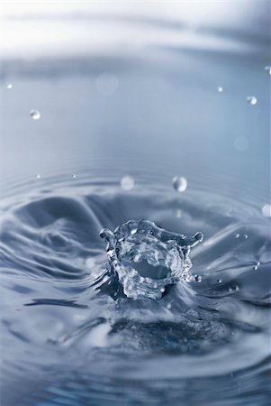 simsearch:614-06813723,k - Water splash with angled crown and ripples Stock Photo - Budget Royalty-Free & Subscription, Code: 400-04630538