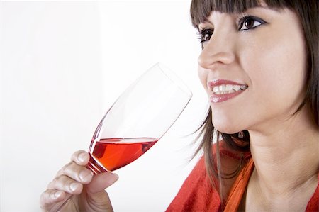 simsearch:400-08348807,k - Close-up of a latina woman with a red cocktail in her hand Stock Photo - Budget Royalty-Free & Subscription, Code: 400-04630761