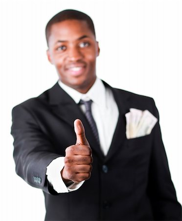 simsearch:400-05718324,k - Close-up of a Afro-American businessman with dollars in a pocket and showing thumb up Stock Photo - Budget Royalty-Free & Subscription, Code: 400-04630956