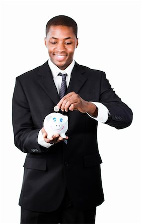 simsearch:400-05715207,k - Smiling Afro-American businessman putting money in his piggy bank Stock Photo - Budget Royalty-Free & Subscription, Code: 400-04630966