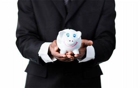 simsearch:400-05715208,k - Close-up of an handsome Afro-American businessman holding a piggy bank Stock Photo - Budget Royalty-Free & Subscription, Code: 400-04630963
