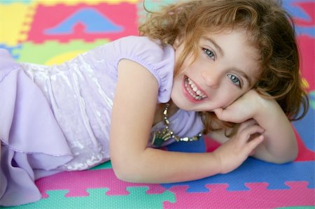 simsearch:400-07509444,k - Beautiful princess little girl smiling lying on the floor Stock Photo - Budget Royalty-Free & Subscription, Code: 400-04631896