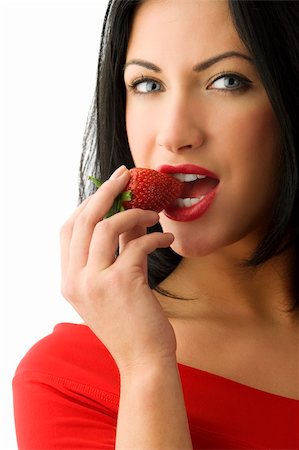 beautiful and sensual brunette girl eating a strawberry with red lips Stock Photo - Budget Royalty-Free & Subscription, Code: 400-04632026