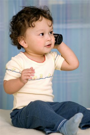 simsearch:400-04638236,k - Baby playing with telephone. Photographie de stock - Aubaine LD & Abonnement, Code: 400-04632996