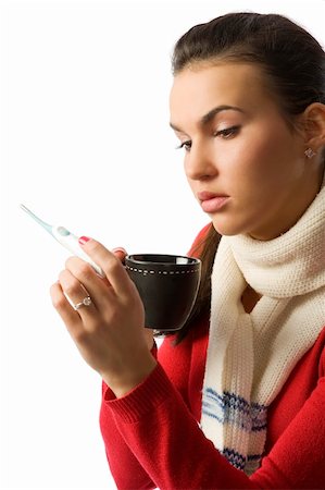 simsearch:400-05716904,k - Closeup portrait of young ill woman checking her body temperature and drinking a cup of tea Stock Photo - Budget Royalty-Free & Subscription, Code: 400-04644596