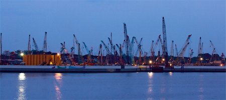 singapore container ship - Harbor cranes in Singapore at dusk. Panoramic photo Stock Photo - Budget Royalty-Free & Subscription, Code: 400-04647114