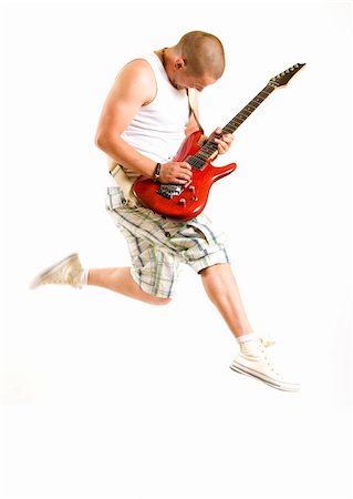 simsearch:400-04863651,k - Passionate guitarist jumps isolated on white background Stock Photo - Budget Royalty-Free & Subscription, Code: 400-04648039