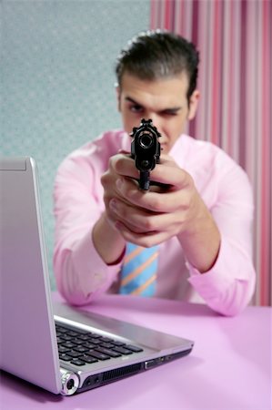 simsearch:400-04131198,k - Businessman point his handgun to camera, wallpaper background Stock Photo - Budget Royalty-Free & Subscription, Code: 400-04649204