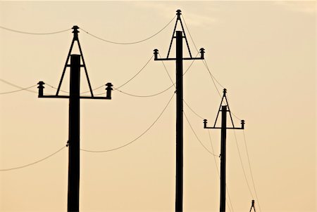 Electricity pylons at orange sunset Photographie de stock - Aubaine LD & Abonnement, Code: 400-04640684
