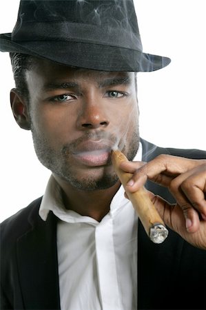 simsearch:400-05207678,k - African american man smoking cigar portrait with black hat Stock Photo - Budget Royalty-Free & Subscription, Code: 400-04641835