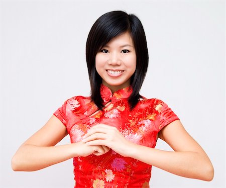 seasons of the year sign - Oriental girl wishing you a happy Chinese New Year. Stock Photo - Budget Royalty-Free & Subscription, Code: 400-04642271