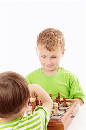 simsearch:400-04638236,k - Two joyful little boys play chess, isolated Photographie de stock - Aubaine LD & Abonnement, Code: 400-04654343