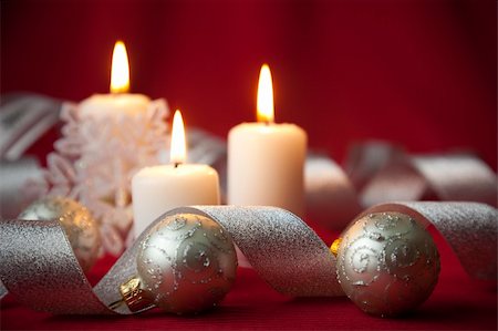 Christmas decoration with candles and ribbons / red and silver Stock Photo - Budget Royalty-Free & Subscription, Code: 400-04654843