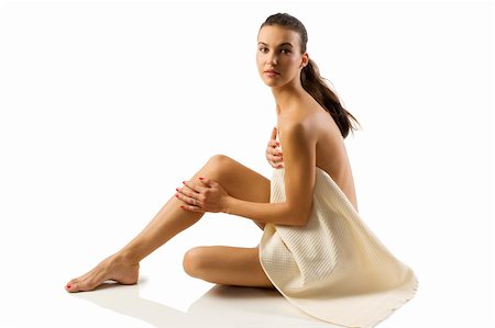 simsearch:400-05322963,k - beauty shot of pretty young brunette sitting down and covering her body with a white bath towel Stock Photo - Budget Royalty-Free & Subscription, Code: 400-04658848