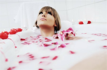 woman beauty spa and wellness treathment with red flower petals in bath Stock Photo - Budget Royalty-Free & Subscription, Code: 400-04659354
