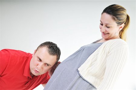 young family couple together in studio isolated on white. happy and waiting for baby Stock Photo - Budget Royalty-Free & Subscription, Code: 400-04659408