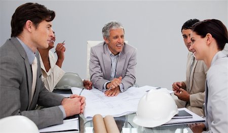 drawing of a racing man - Group of architects studying plans in a meeting Stock Photo - Budget Royalty-Free & Subscription, Code: 400-04659732