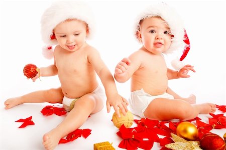 Two cute laughing babies in xmas hats Stock Photo - Budget Royalty-Free & Subscription, Code: 400-04652301