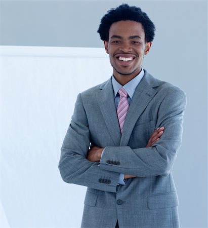 simsearch:400-05710386,k - Confident and smiling Afro-American businessman in a presentation Stock Photo - Budget Royalty-Free & Subscription, Code: 400-04653144