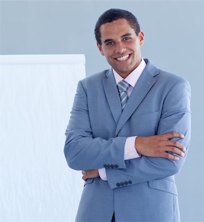 simsearch:400-05710382,k - Smiling young businessman giving a presentation on the whiteboard Photographie de stock - Aubaine LD & Abonnement, Code: 400-04653153