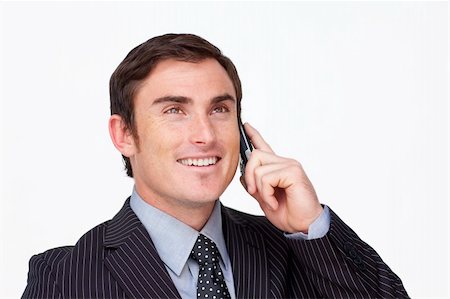 simsearch:400-04212823,k - Portrait of an attractive smioing businessman on mobile against white Stock Photo - Budget Royalty-Free & Subscription, Code: 400-04653368