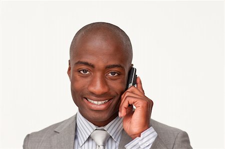simsearch:400-04212823,k - Portrait of an Afro-American businessman talking on mobile phone against white Stock Photo - Budget Royalty-Free & Subscription, Code: 400-04653375