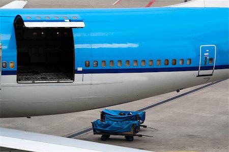 Airplane with open hatch. Ready to be loaded Stock Photo - Budget Royalty-Free & Subscription, Code: 400-04653974