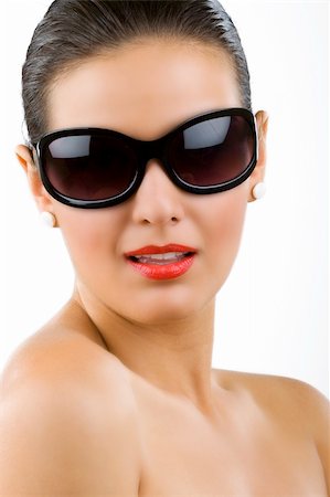 simsearch:400-05678958,k - beautiful girl wears sunglasses over white back ground Photographie de stock - Aubaine LD & Abonnement, Code: 400-04664876