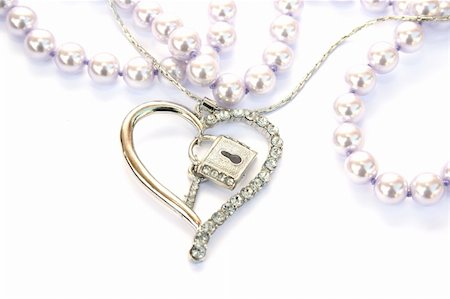 simsearch:400-04839979,k - Silver heart,key,lock, pearls isolated on white background. Stock Photo - Budget Royalty-Free & Subscription, Code: 400-04666088