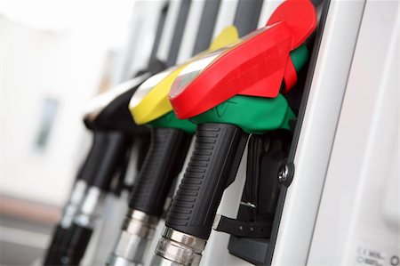 Several gasoline pump nozzles at petrol station Stock Photo - Budget Royalty-Free & Subscription, Code: 400-04666676