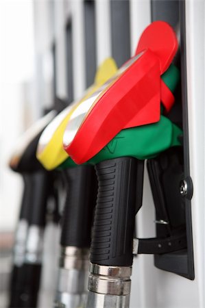 Several gasoline pump nozzles at petrol station Stock Photo - Budget Royalty-Free & Subscription, Code: 400-04666677